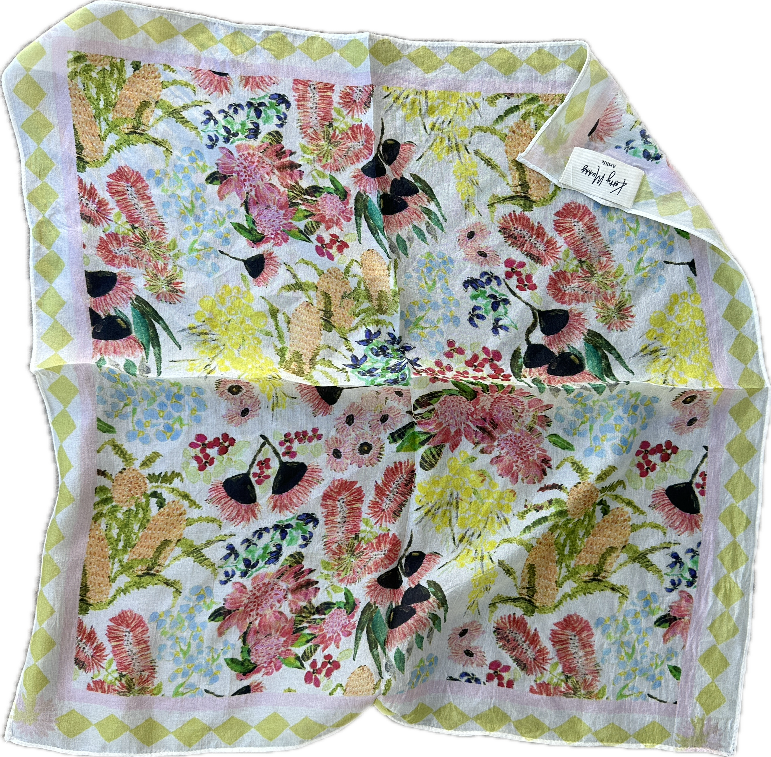 Australian Florals wearable art bandanna featuring soft wildflower-inspired artwork in pastel tones styled as a bohemian hair scarf