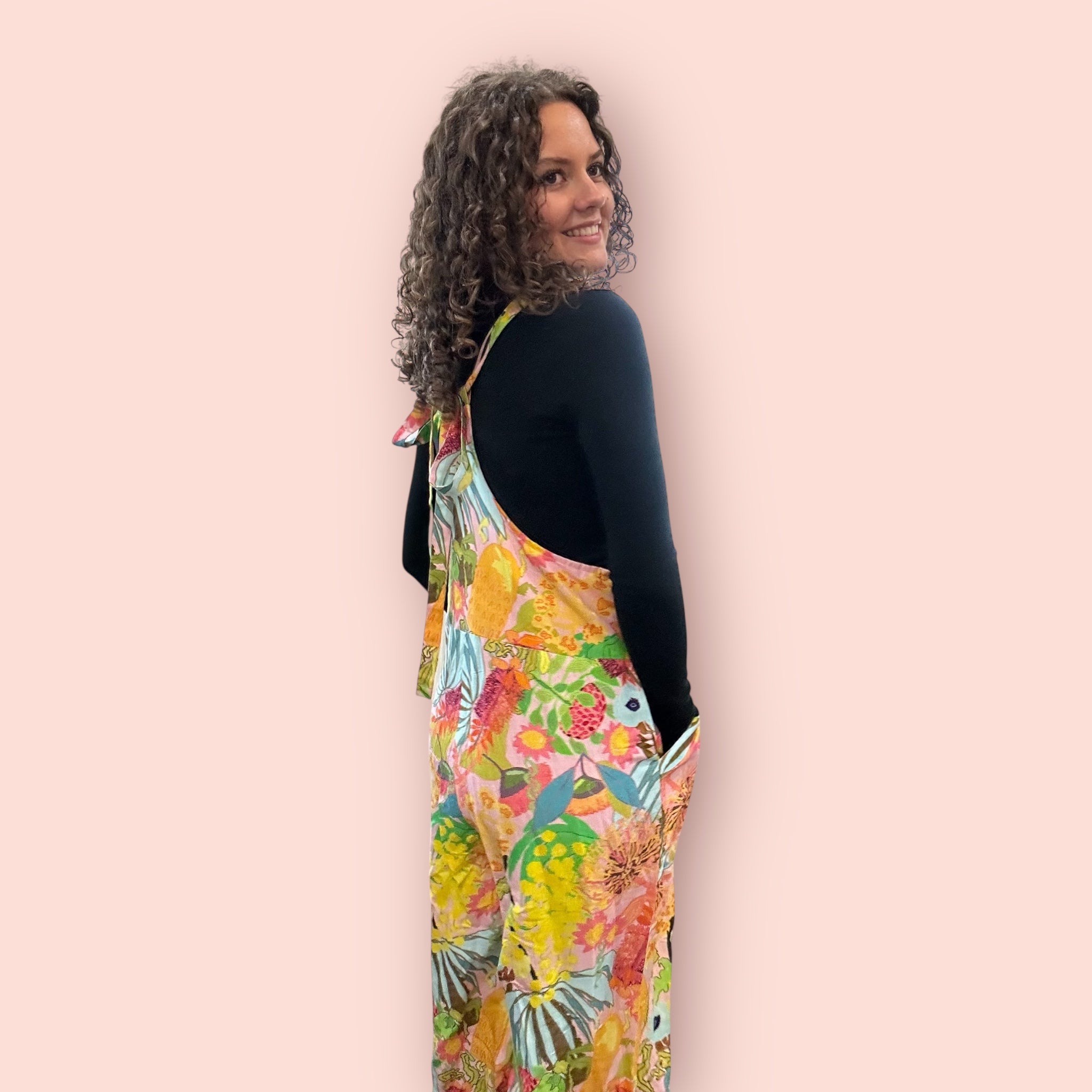 Wearable art jumpsuit in an intuitive expressionist style, designed for bold women's fashion back view.