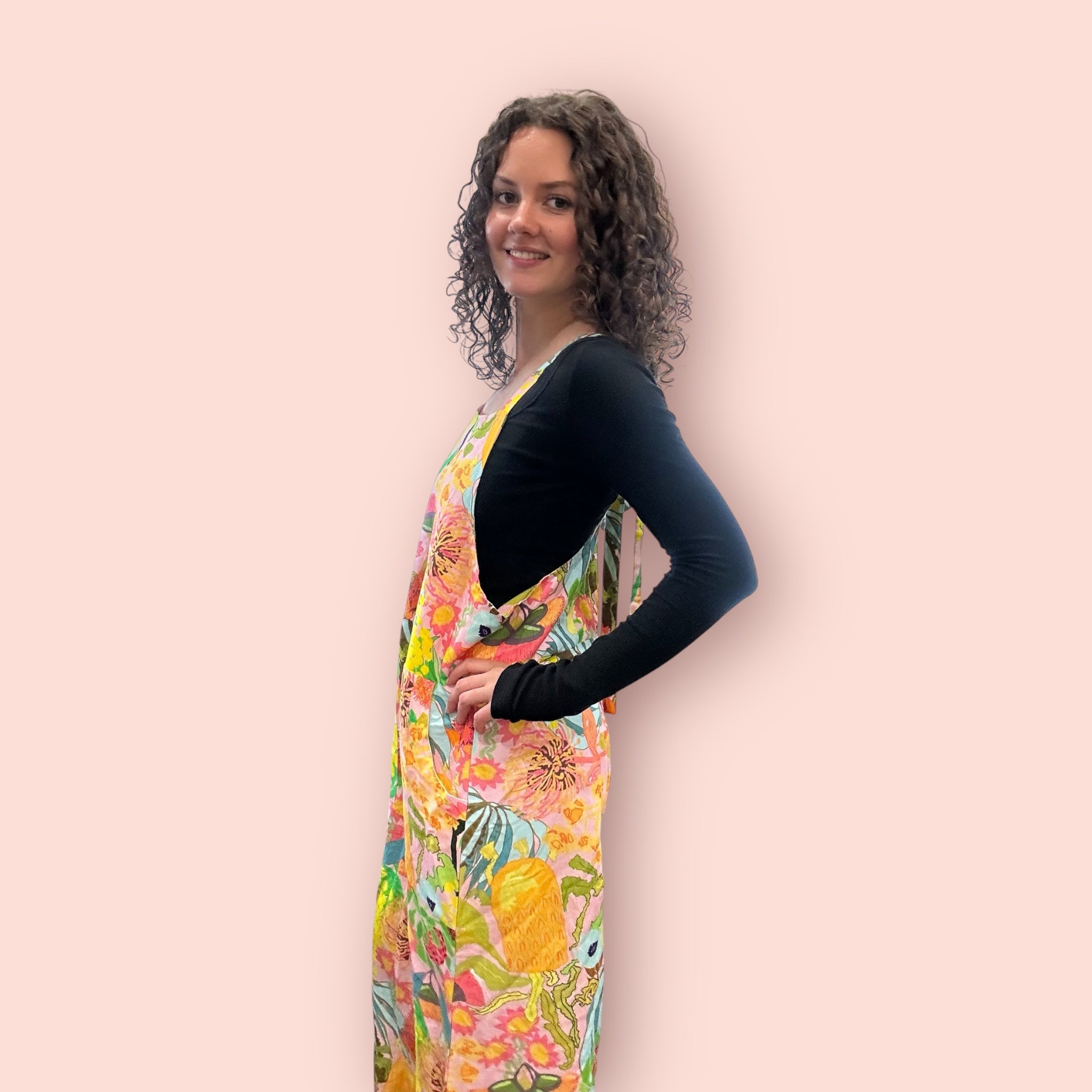 Wearable art jumpsuit in an intuitive expressionist style, designed for bold women's fashion, side view