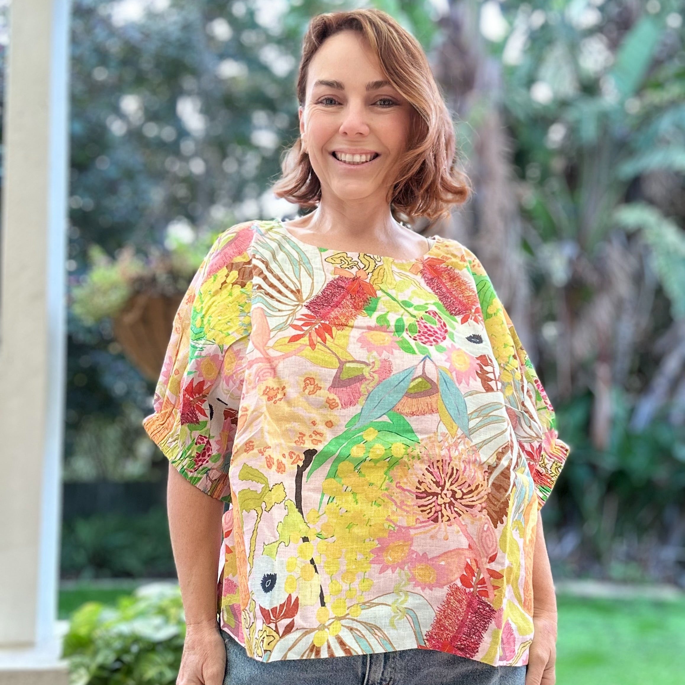 Relaxed fit linen top with colourful yellows native floral artwork by Kerry Munns
