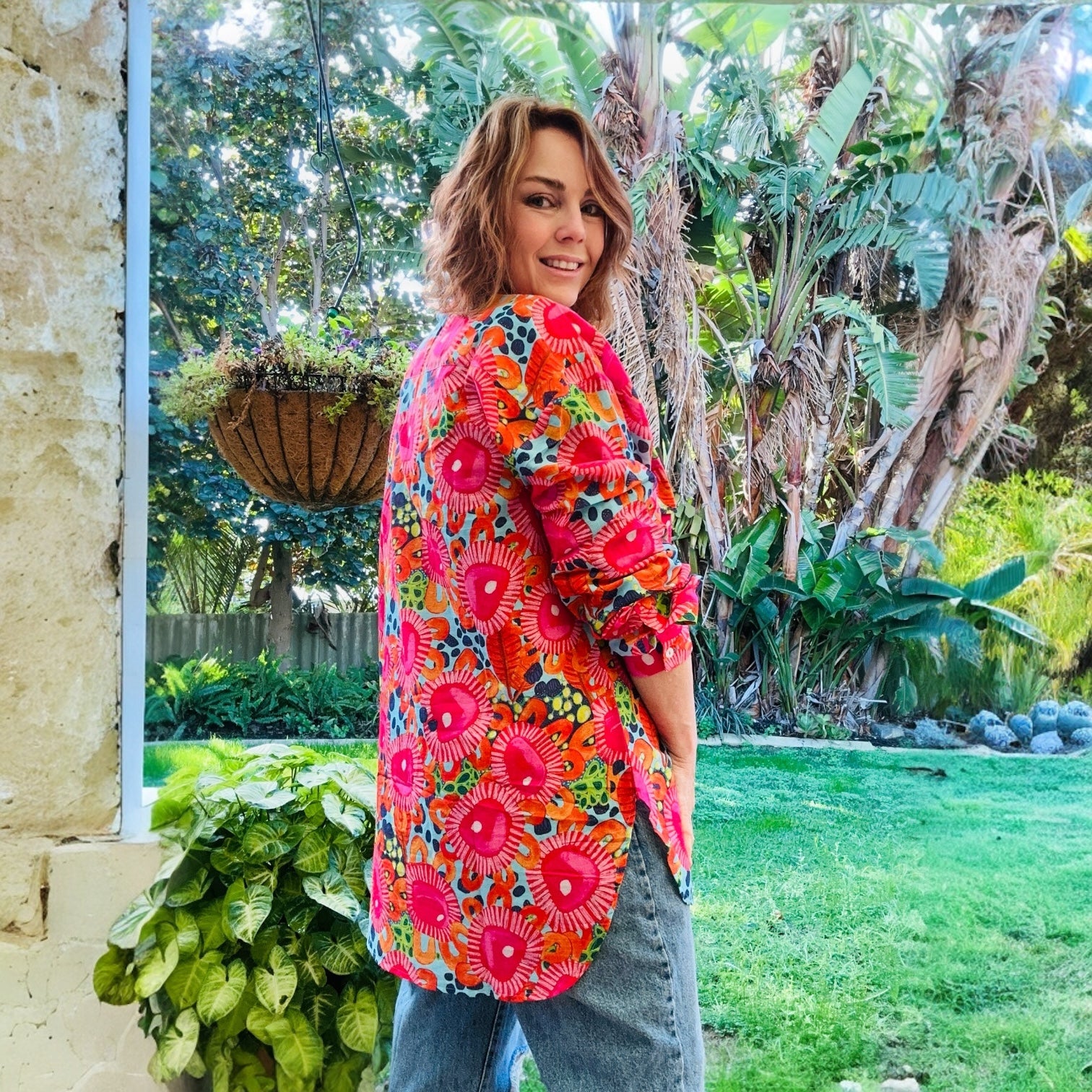 Nature-themed wearable art shirt with wild green botanical print – women's eco fashion