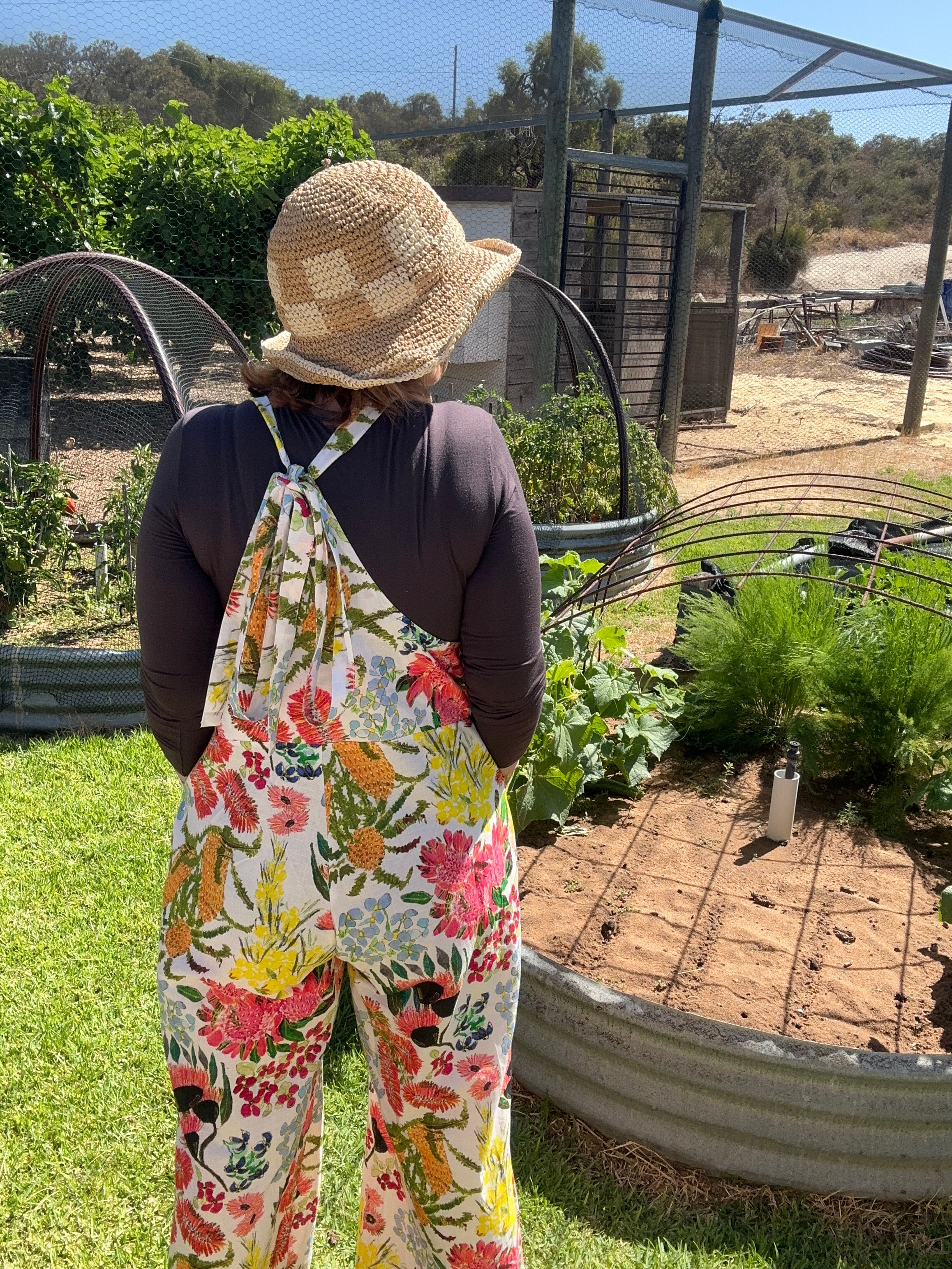 Zoe Playsuit in Spring Fling by Kerry Munns Artlife showcasing vibrant wildflowers in wearable art on sustainable linen fabric back view