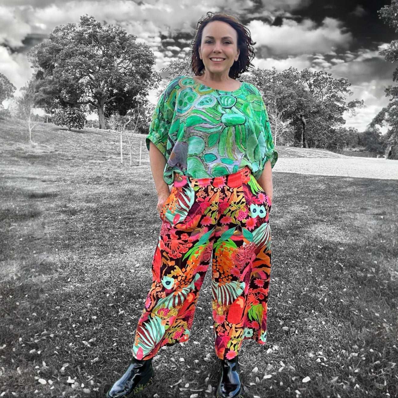 Wearable art denim pants with pockets in a colourful floral design