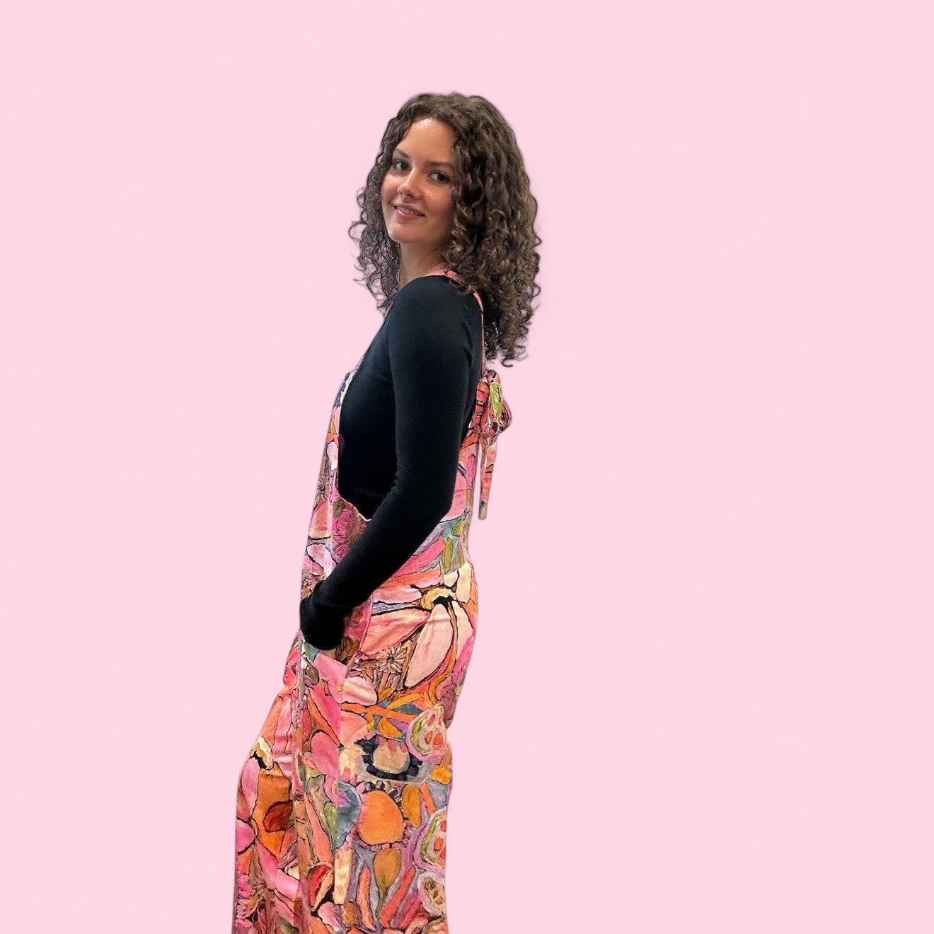 Boho-style painted jumpsuit with intuitive expressionist art, a bold women's fashion statement side view