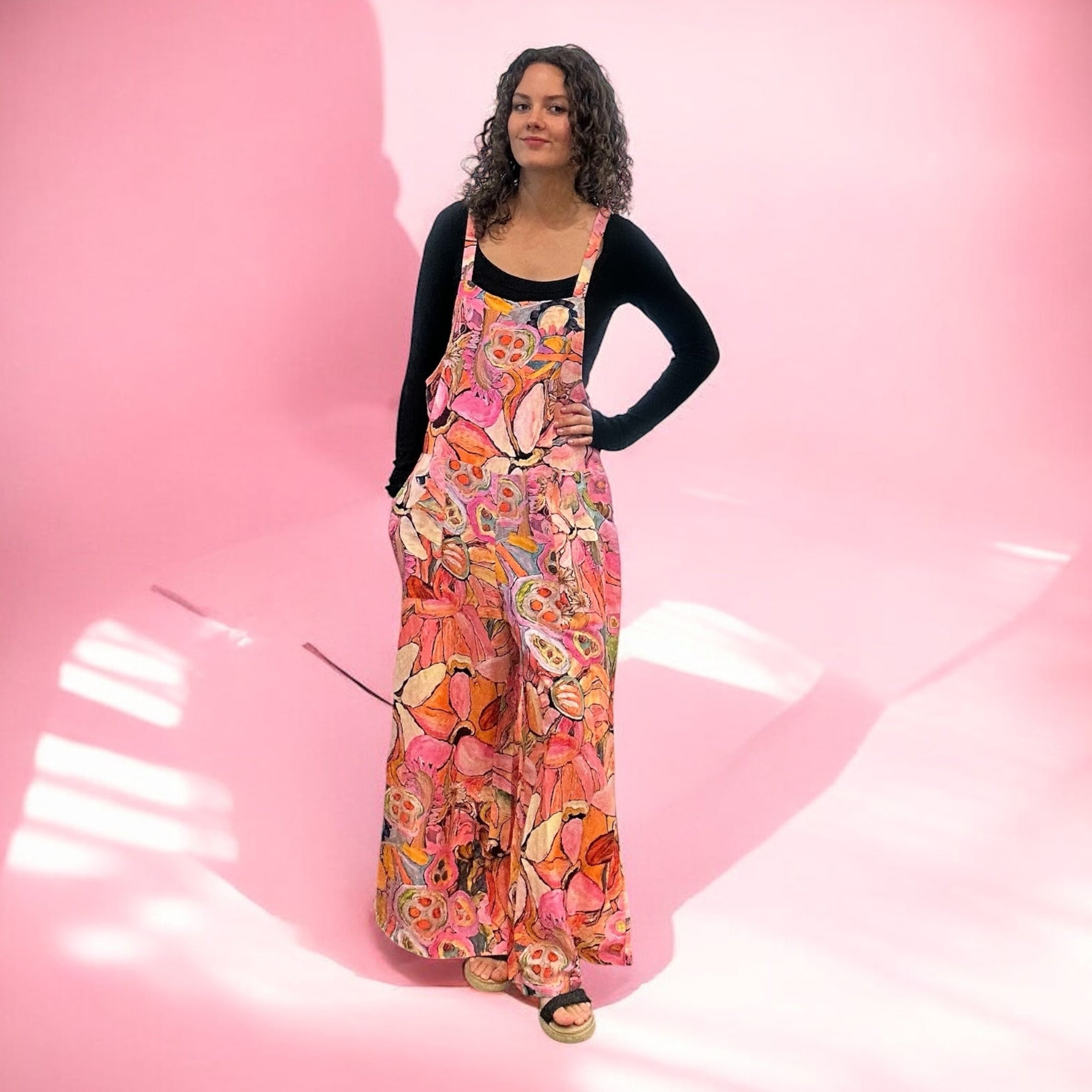 Boho-style painted jumpsuit with intuitive expressionist art, a bold women's fashion statement