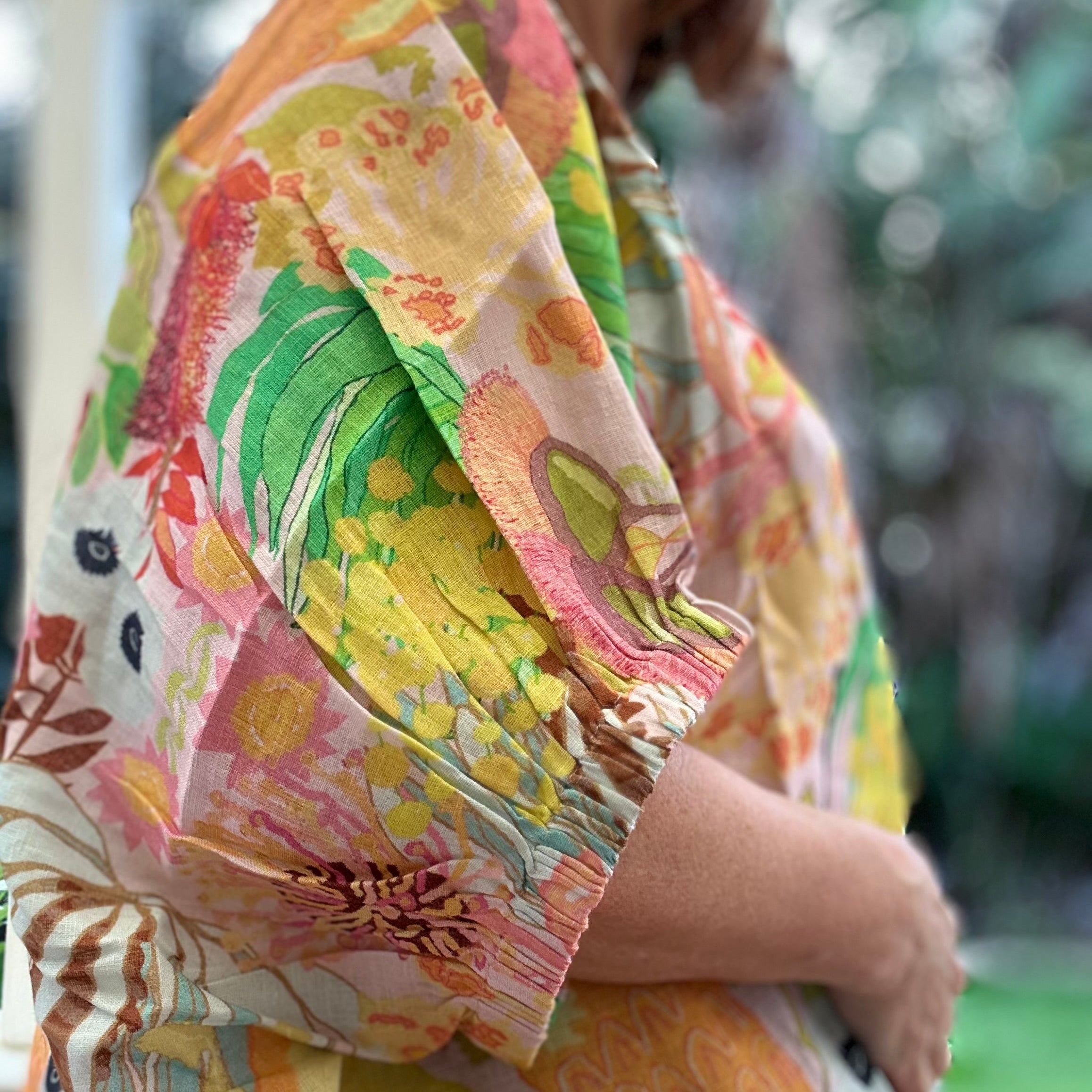Women's wearable art linen blouse sleeve with Australian wildflower botanical print design