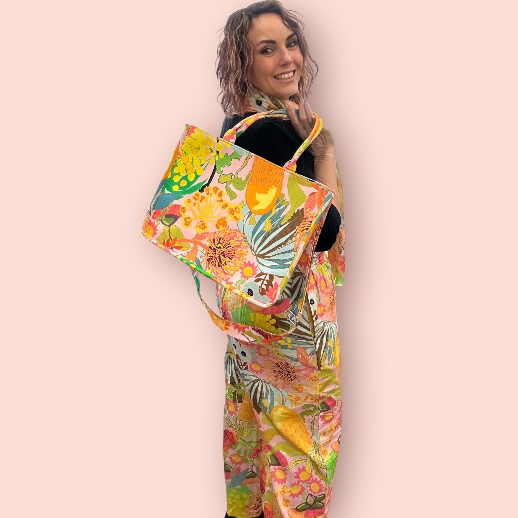 handbag and boho wide-leg linen pants in colourful wearable art style