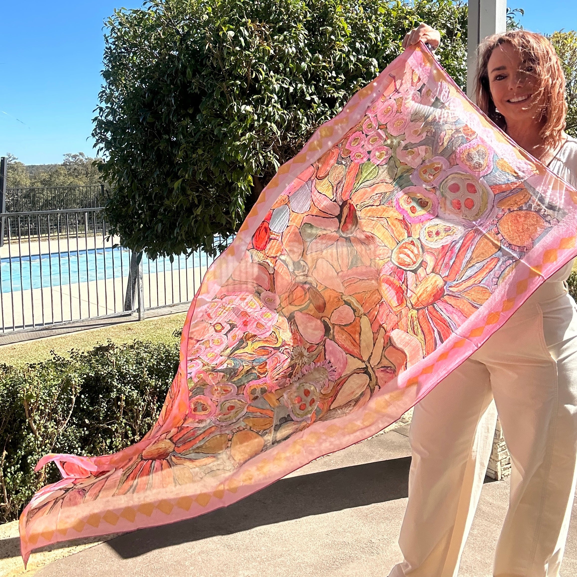 Blush pink oversized wearable art silk scarf featuring painterly floral artwork by Kerry Munns Art
