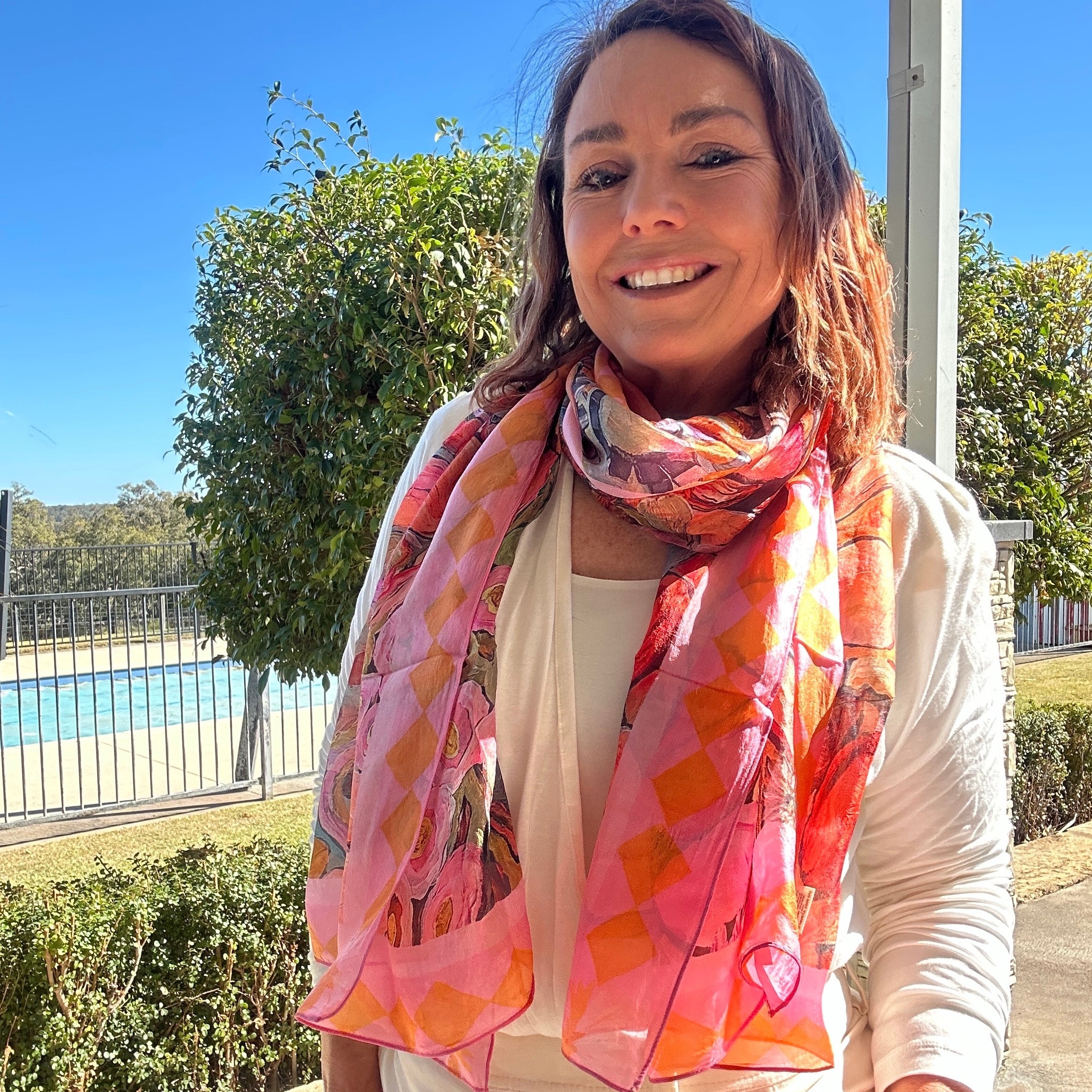 Pink oversized wearable art silk scarf featuring painterly floral artwork by Kerry Munns Art