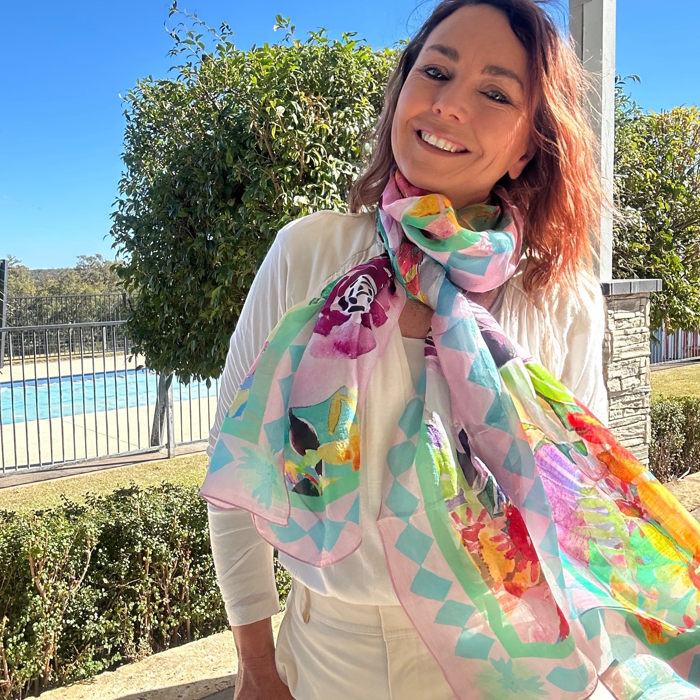 Oversized wearable art silk scarf featuring soft floral artwork in pastel tones by Australian artist Kerry Munns