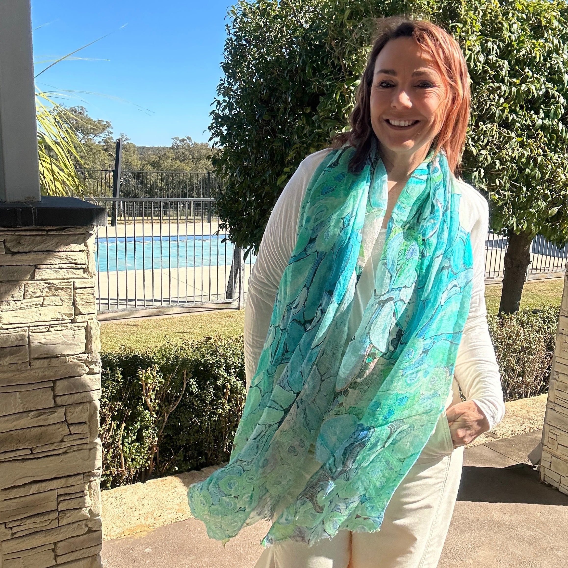 Turquoise and aqua wearable art linen scarf with abstract coastal-florals inspired artwork by Kerry Munns.