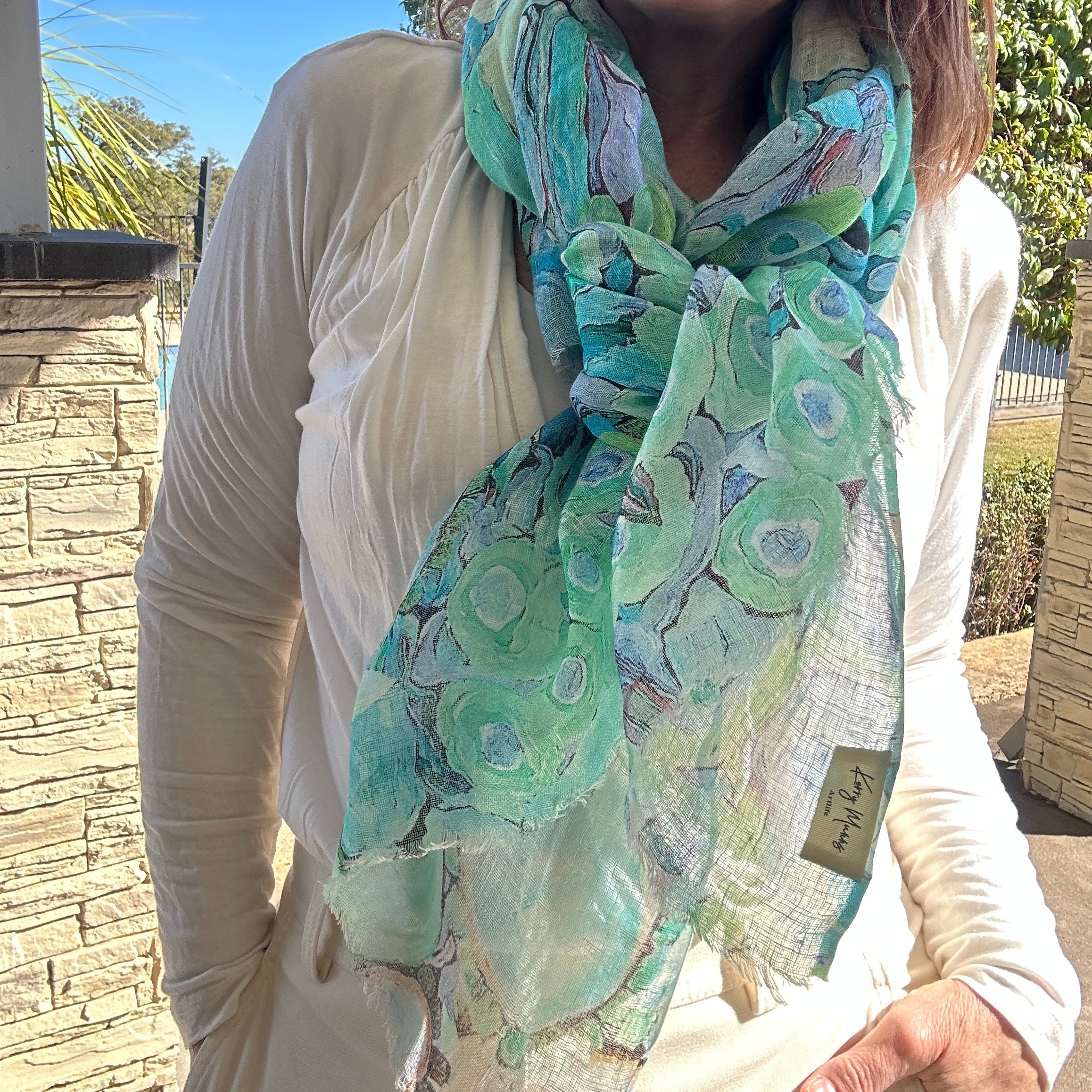 Turquoise and aqua wearable art linen scarf with abstract coastal-inspired blooms abstract by Kerry Munns