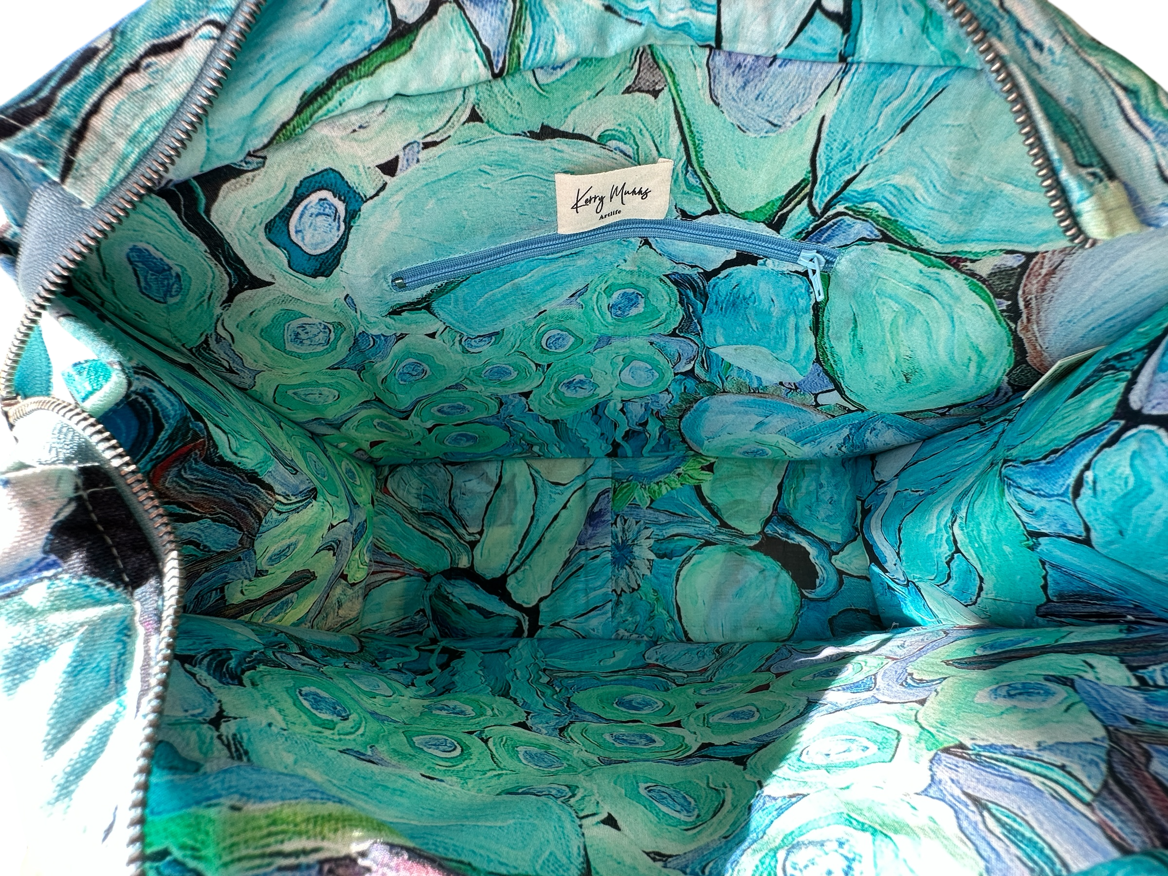 Luxury wearable art handbag for women in turquoise and blue floral abstract print with interior pocket 