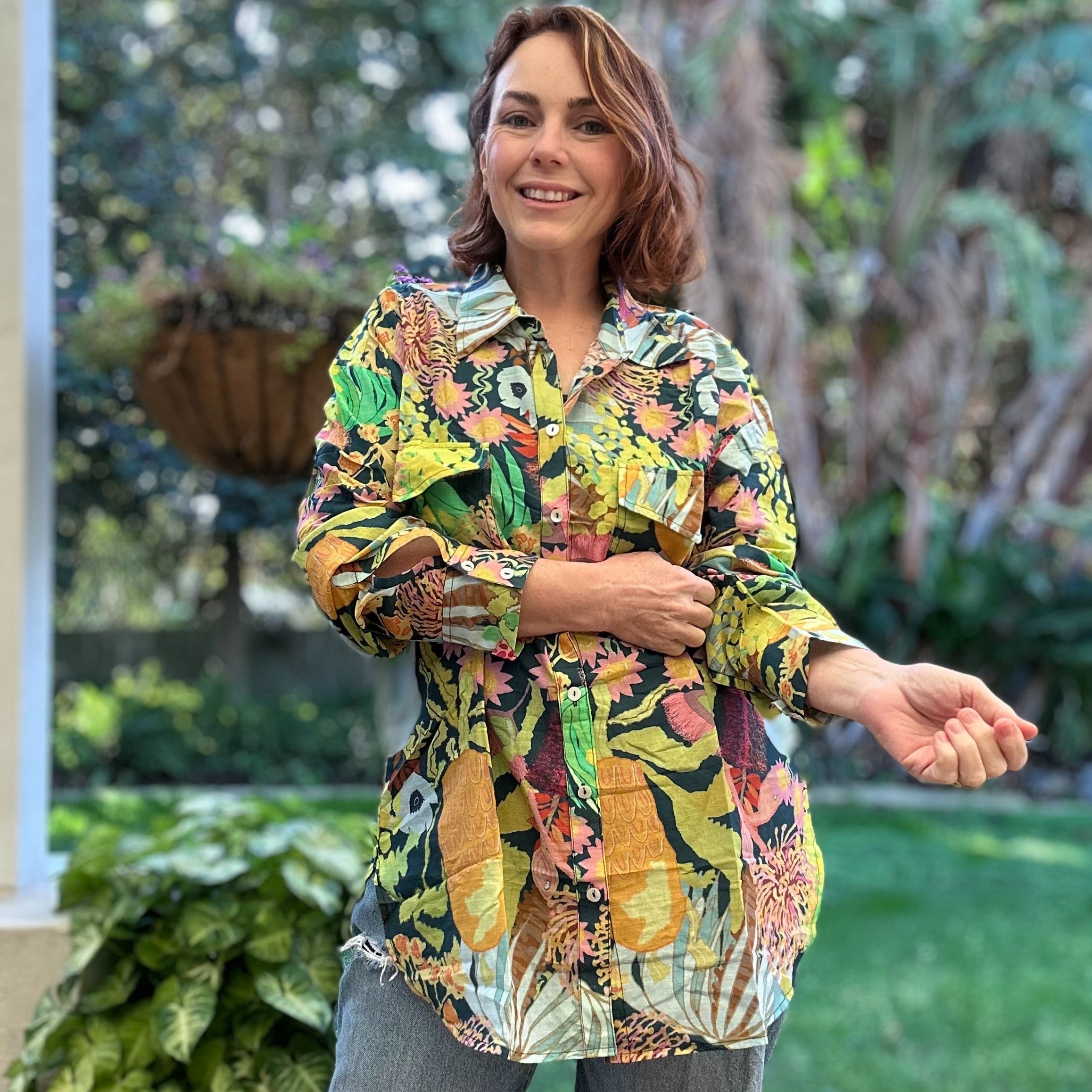 Floral linen shirt with hand-painted wildflowers – vibrant wearable art for women’s summer style