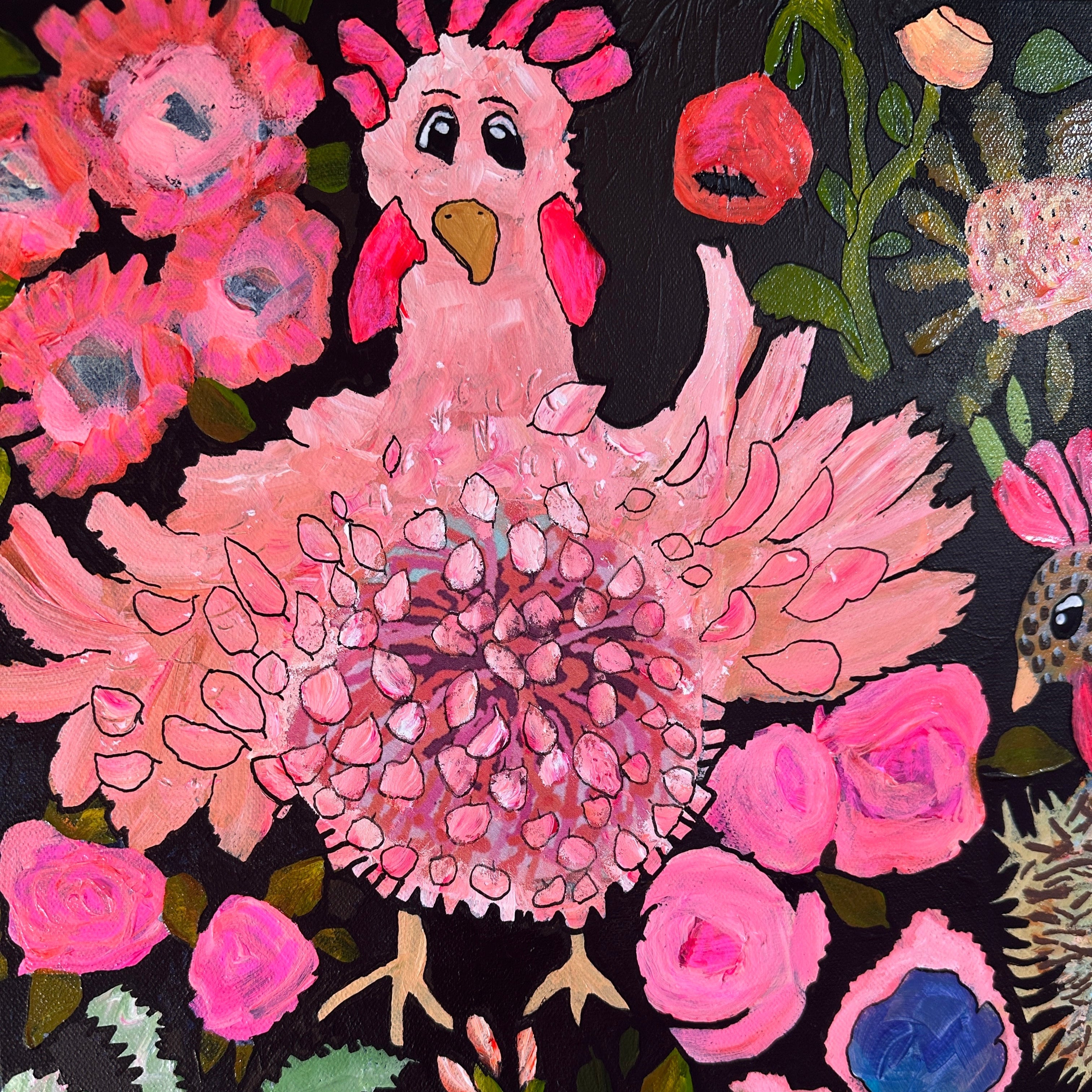 Colorful artwork of a pink chicken surrounded by flowers on a black background
