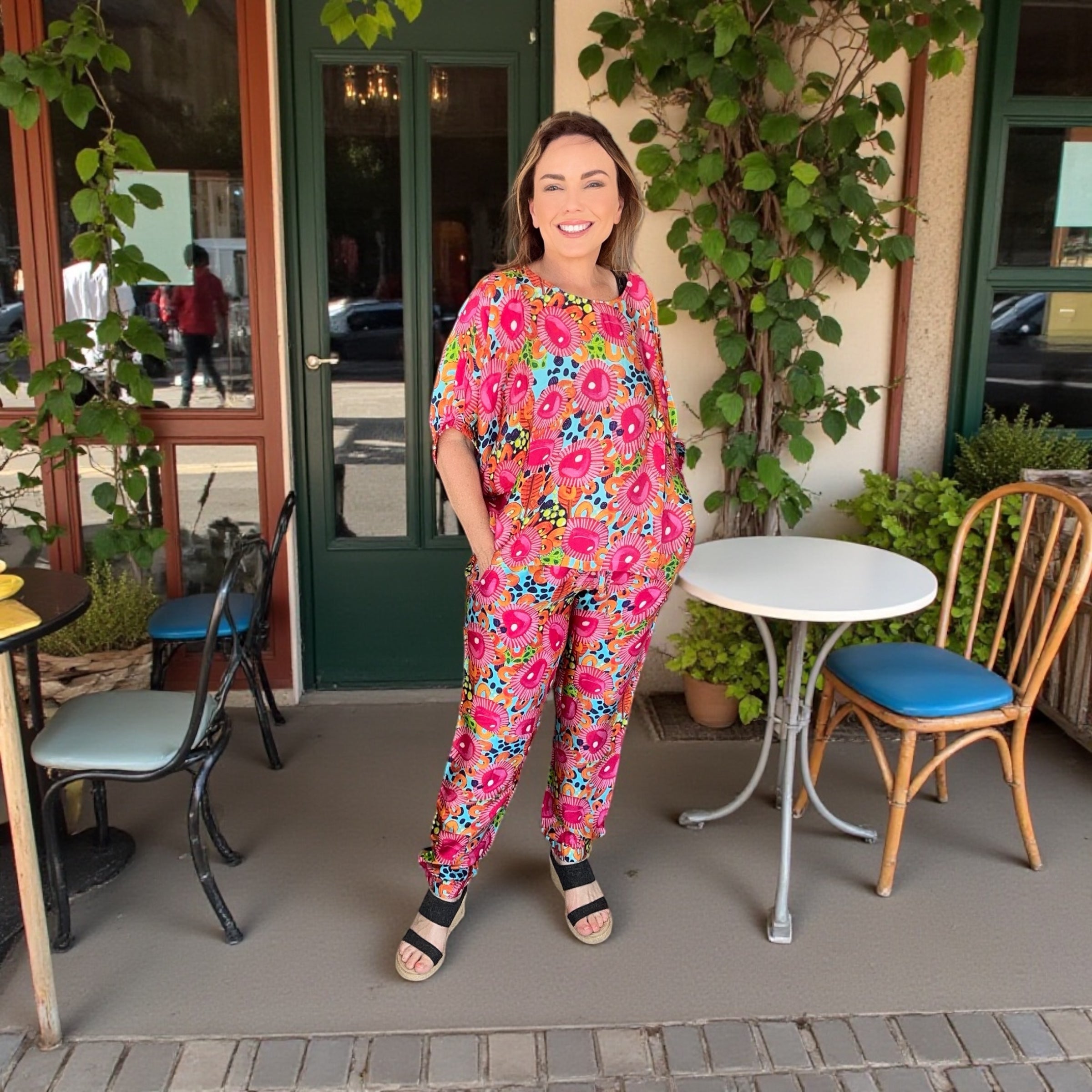 Sporty Luxe silk pants featuring original artwork by Kerry Munns, combining relaxed athletic style with elevated women’s wearable art fashion in Mrs Pearl